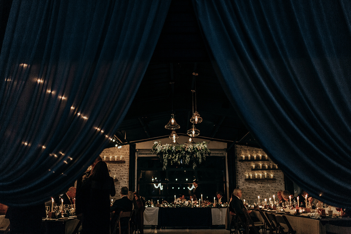 Low lighting, candles and curtains decorate the interior of The Forge Venue